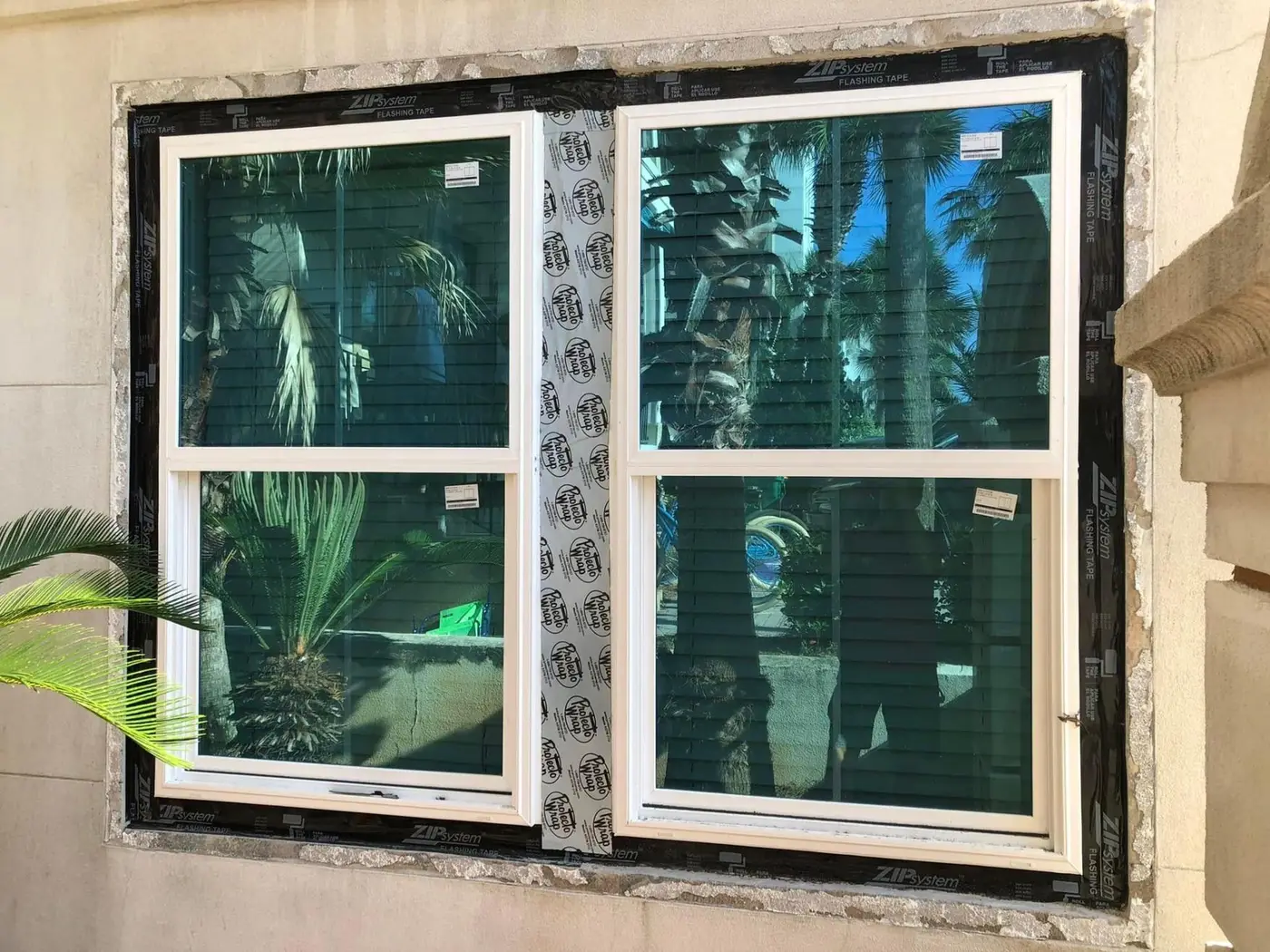 Hurricane-rated double-hung impact windows with ZIP flashing installed by Lesher Contracting in Santa Rosa Beach, FL